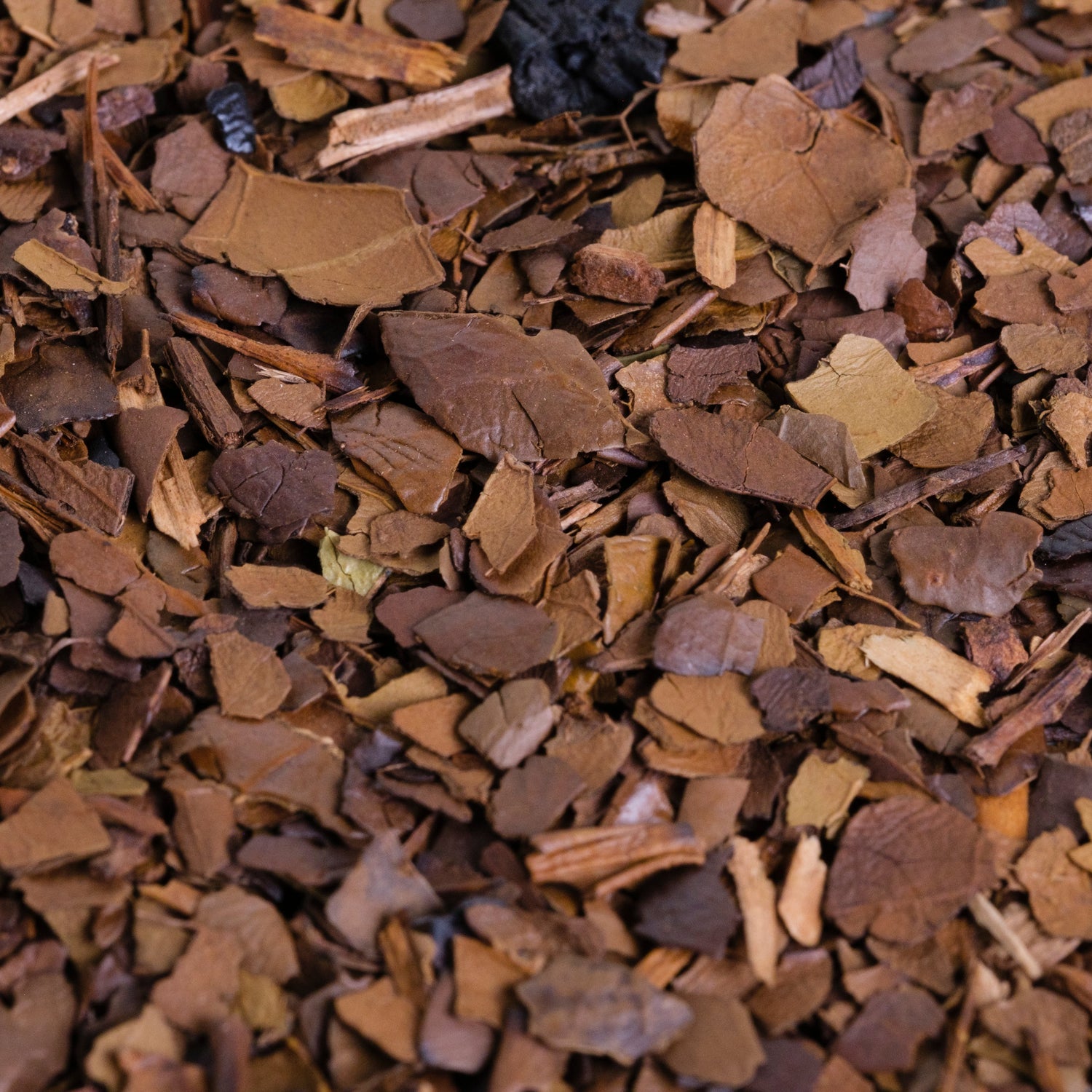 Close-up of Yerba Montana roasted mate, showing light to dark brown shades


